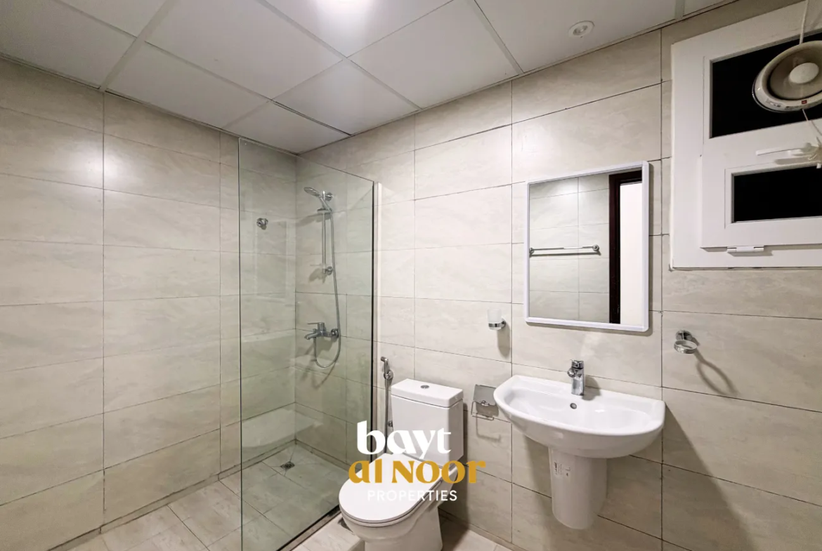 For Rent: Spacious 2-Bedroom Flat with Private Parking in Qurum | REF KT5027