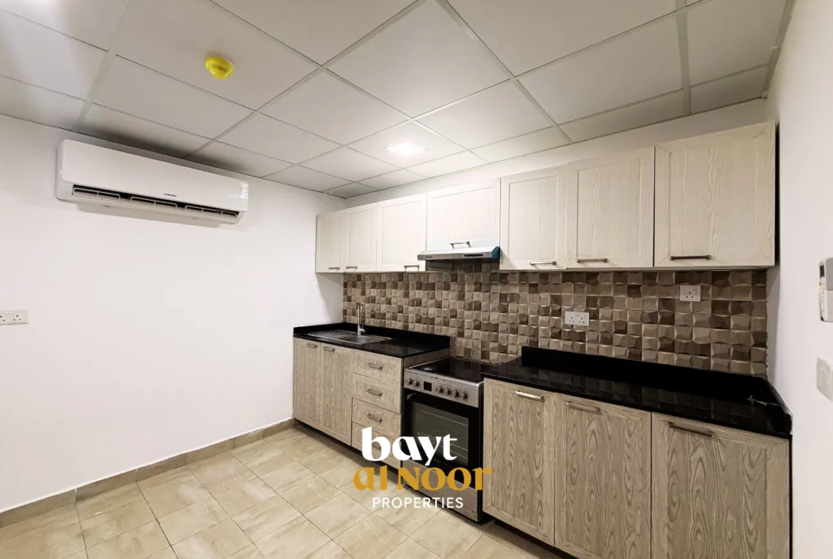 For Rent: Spacious 2-Bedroom Flat with Private Parking in Qurum | REF KT5027